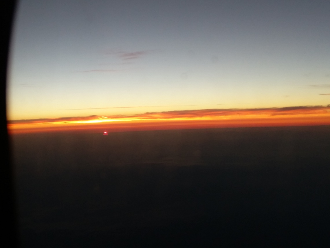Sunrise from airplane - August 2015.jpg